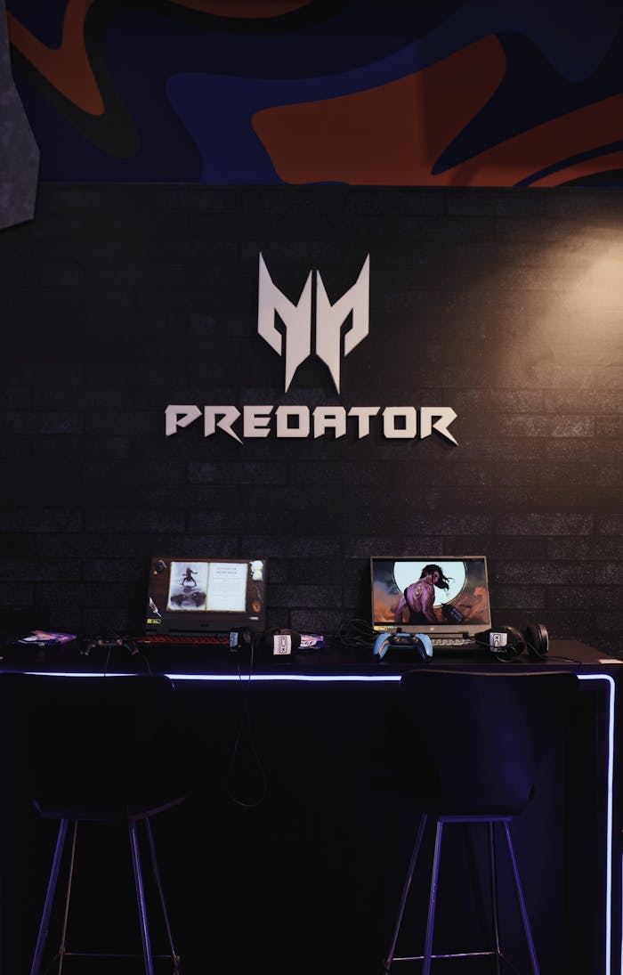 Gaming area featuring dual Predator laptops on a desk, ideal for gaming conventions.